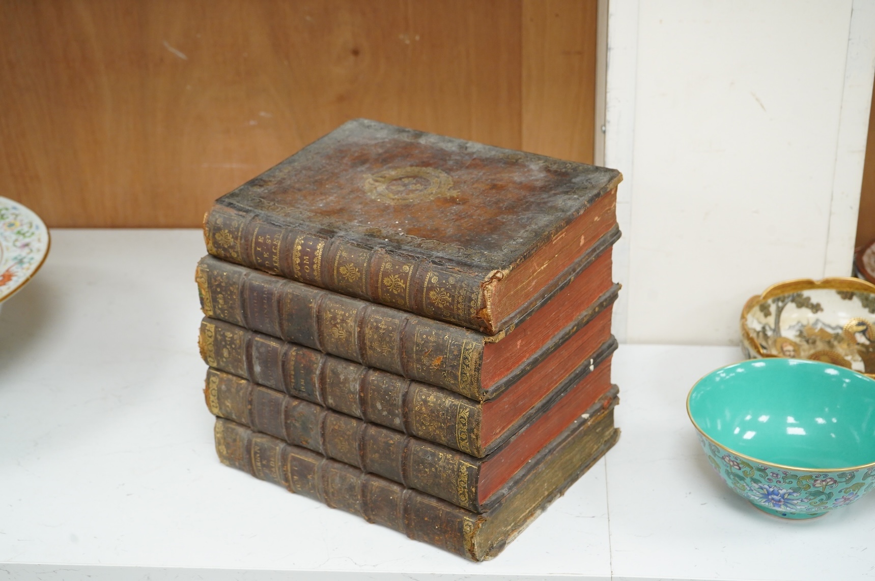 A novelty stack of books liqueur set, the contents including, decanter with stopper and five glasses, 26cm wide x 23cm high